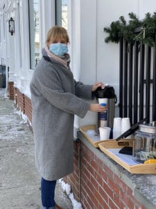 Jackie Johnson serves hot chocolate during the Churros and Hot Chocolate fundraiser
