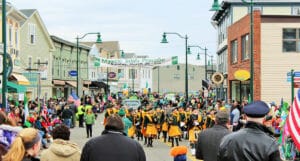 Crowds through East Main Street in downtown Mystic for the Mystic Irish Parade