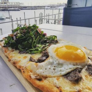Brunch Pizza with a sunny side up egg at Red 36 (the best lunch spot in Mystic) along the waterfront in Mystic